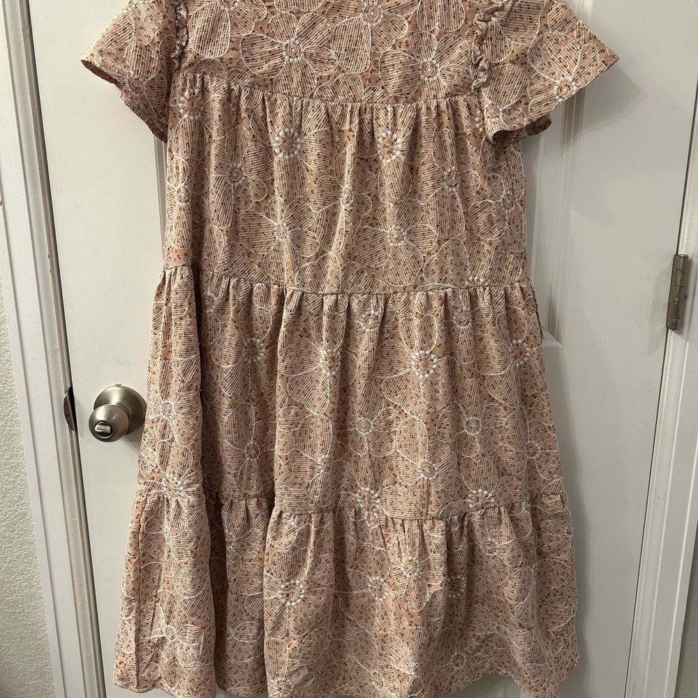 Tiered floral dress with beautiful stitching detail.
